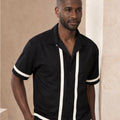 Man wearing a black shirt with white trim .Perfect Statement shirt