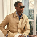 Man wearing a beige linen jacket